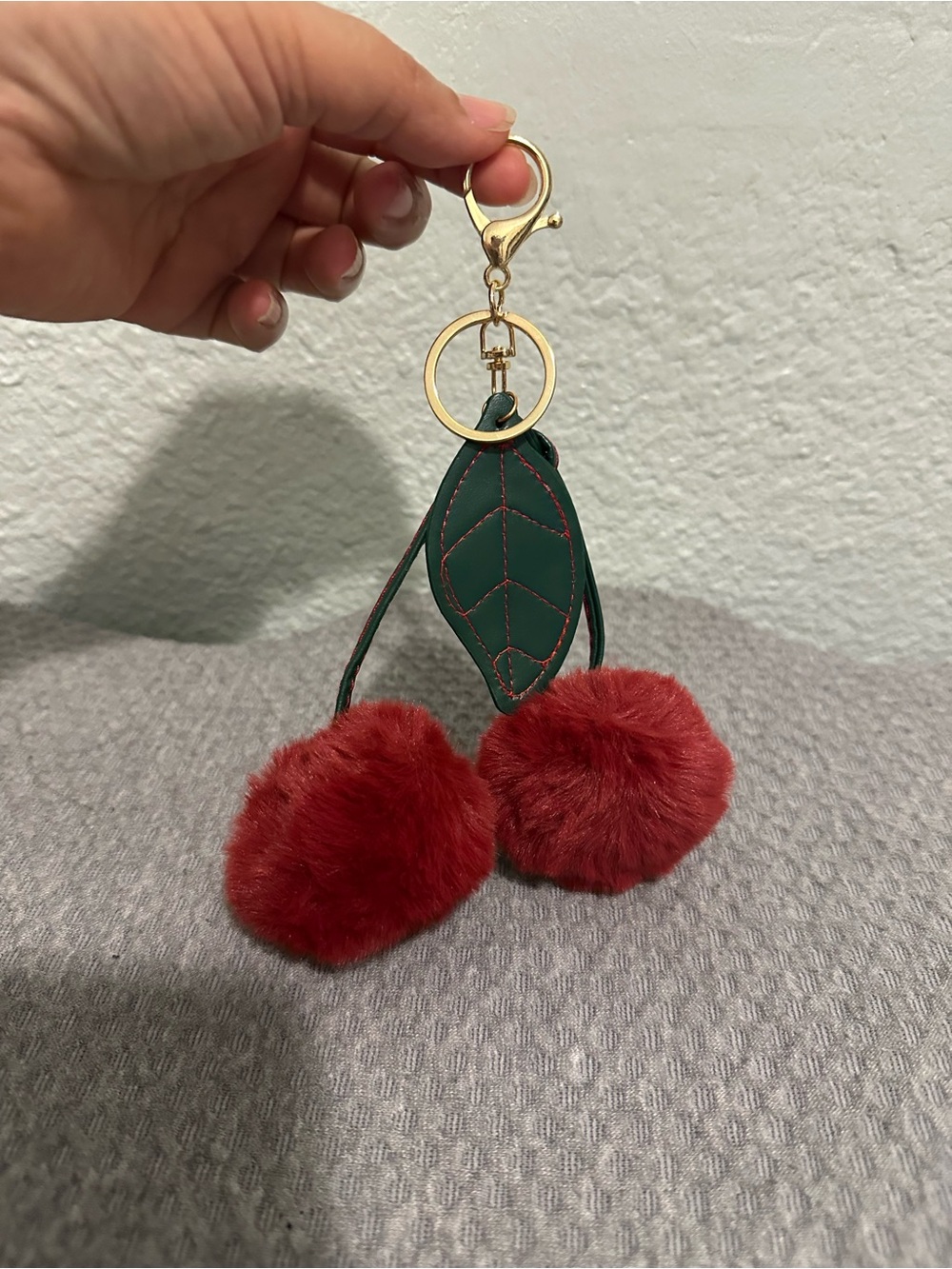 Bag charm Cherry Pom Pom Keychain with Green Leaf and Gold Hardware